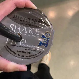 a person holding a cup of tea