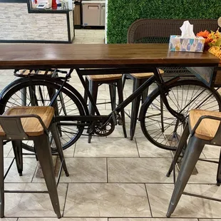 A cute table with a bicycle as the legs!
