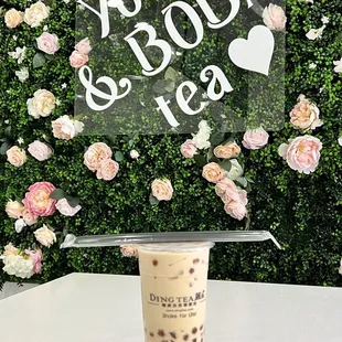 Signature Milk Tea with boba and coconut jelly.