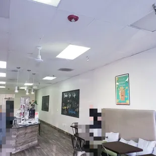 the inside of a restaurant with tables and chairs
