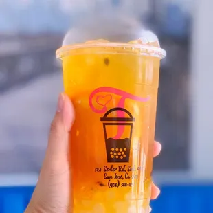 a hand holding a cup of tea