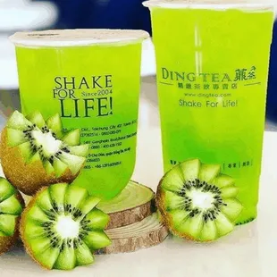 a cup of drink and kiwi