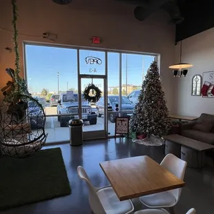 a living room with a christmas tree