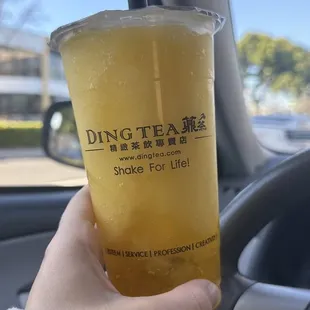 a person holding a drink