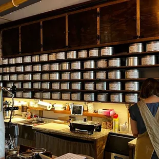 a woman working in a tea shop