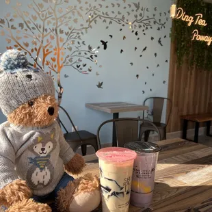 Teddy with his drinks: Large jasmine green milk tea with grass jelly Large taro milk tea with pudding