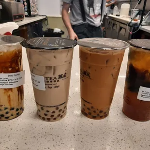 Monster boba, signature milk tea, Thai tea, and lychee green tea with grass jelly