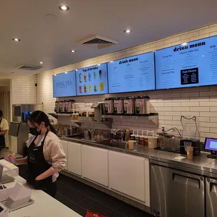 a woman working in a coffee shop