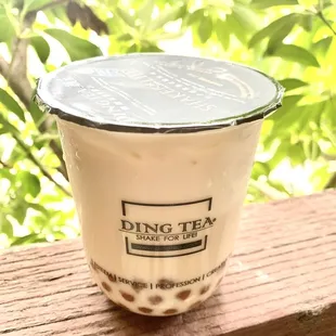 Honey milk green tea with golden boba