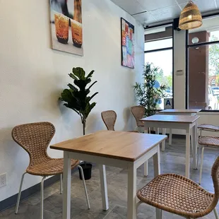 a table and chairs in a coffee shop