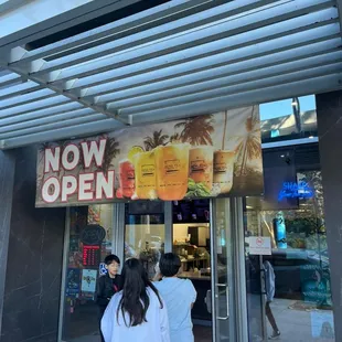 two people entering a restaurant