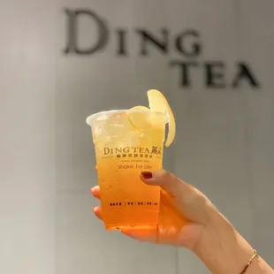 a person holding a drink