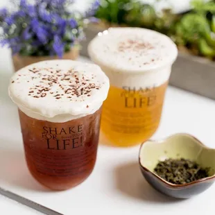 two cups of tea and a spoon