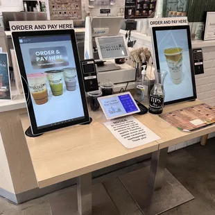 Self serve kiosk up and running. They charge you a $.10 "convenience" fee to use.