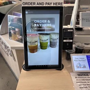 Self serve kiosk up and running. They charge you a $.10 "convenience" fee to use.