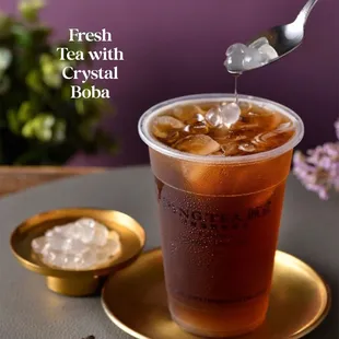 a drink being poured into a cup