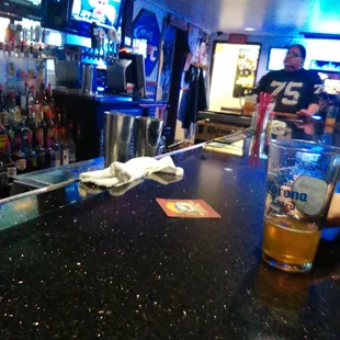 a glass of beer on the bar