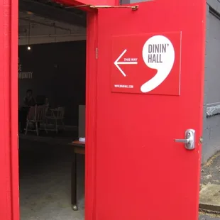  red door with a sign on it
