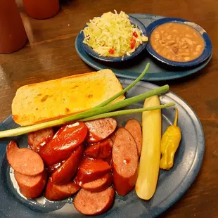 Sausage plate with coleslaw and pinto beans
