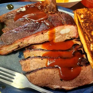 Two Meat Combination; Sliced Beef Brisket, Hickory Smoked Ribs, Texas Toast, and a Pickle