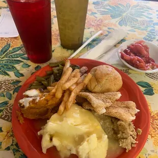 Green beans, turnip greens, stuffing, mashed potatoes with gravy, fried catfish, fries, creamed corn, muffin, sweet tea