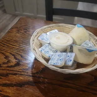 a basket of cheese and butter