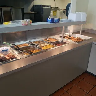 a variety of food in a buffet