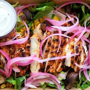 Chipotle grilled chicken salad with cilantro-lime aioli.