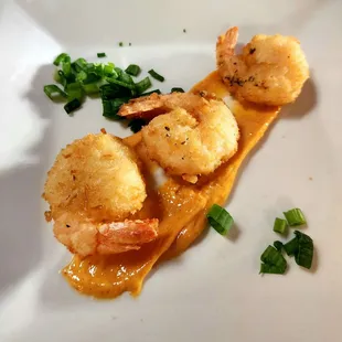 shrimp and scallops on a white plate