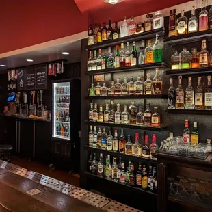 a bar with many bottles of alcohol