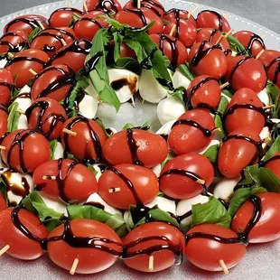 a platter of tomatoes and mozzarella