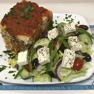 Homemade Greek lasagna ( pastitsio) ziti , homemade meat sauce ,and creamy mpesamel on top delicious , lunch Dinner dish .