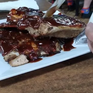 Full rack of ribs with salad and cup of soup about $16