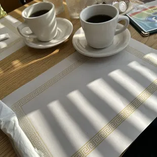 two cups of coffee on a table
