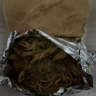 Italian burger. Served on garlic bread. Comes with pasta and meat sauce.