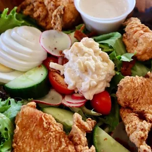 a salad with fried chicken