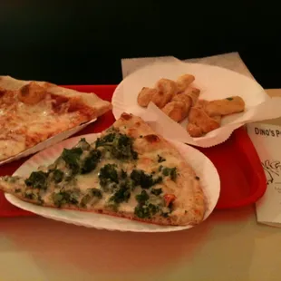 three slices of pizza on a red tray