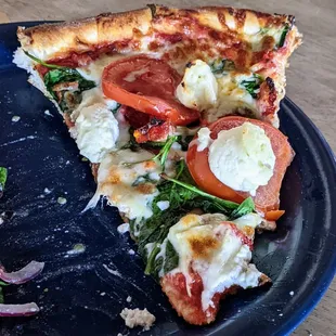 A slice of spinach lasagna pizza... wonderful toppings and crust!