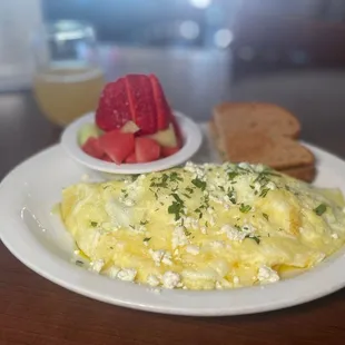 an omelet with a side of fruit