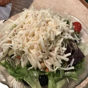House salad with a mound of cheese