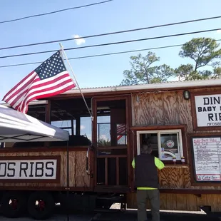 a man standing in front of a food truck