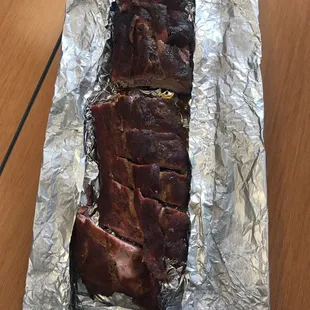 a piece of meat wrapped in tin foil