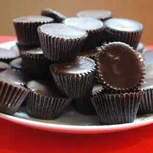 a plate of chocolate cups