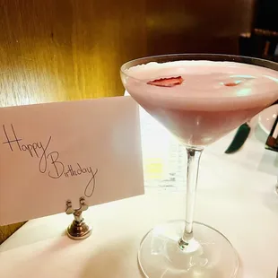 a happy birthday card and a martini