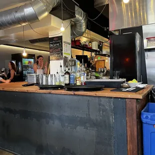 a bar with people sitting at it