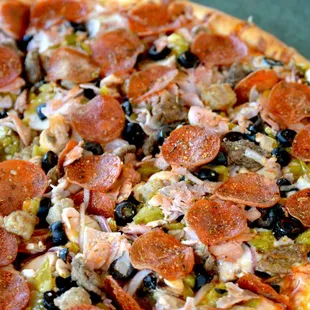 The Special with Italian sausage, mushrooms, black olives, green chile, red onions, ground beef, smoked ham &amp; pepperoni.
