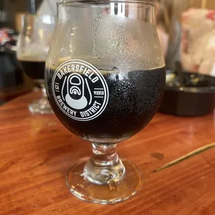 a glass of beer on a table