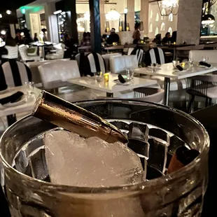 Plata o Plomo.   The metal ice cube in the shape of a rifle round is a nice touch