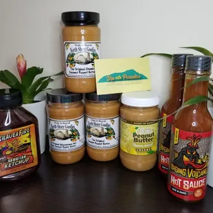 North Shore Goods Coconut PB and Mcadamia Honey Coconut PB, Aloha Banana Macnut PB, Kilauea Fire Spicy Ketchup, Raging Volcano Hot Sauce.