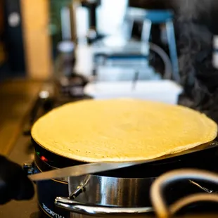 a person cooking on a stove